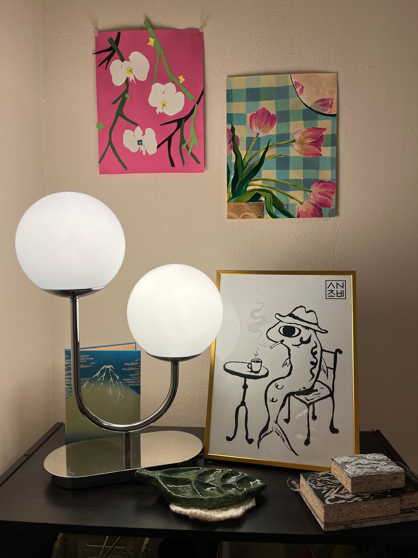 9x12 Matte Finish Black and White Art Print for home, apartment, and room decor. Featured here in a gold frame. Anchovy Studio design original print by independent artists. Inspired by calligraphy and expressionism. In this artwork, an anchovy smokes a cigarette with a cup of coffee, head full of thoughts.